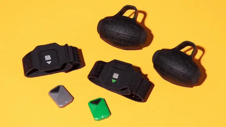 Assorted Liteboxer products including hand weights, wrist straps and motion sensors.
