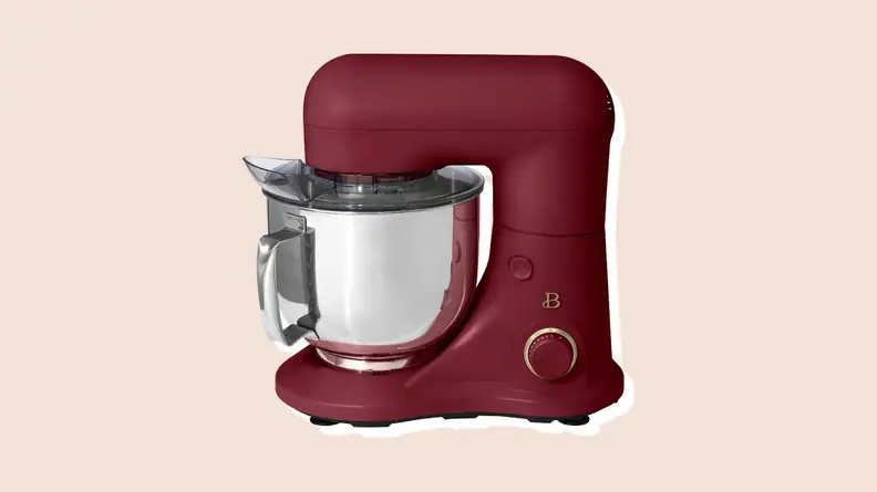 Product shot of burgundy-colored standing mixer from the Beautiful by Drew Barrymore Kitchen Appliances line.