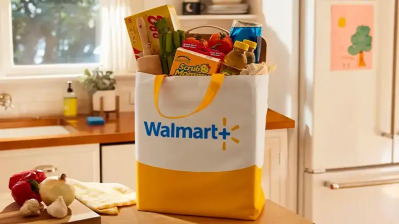A Walmart+ grocery bag in a kitchen.