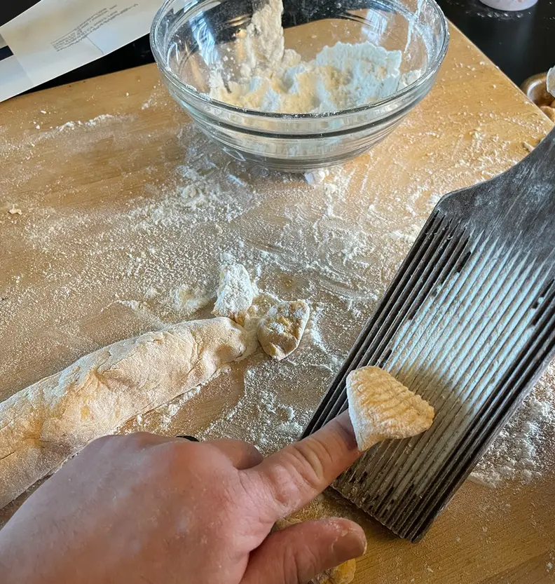Rolling gnocchi on a paddle