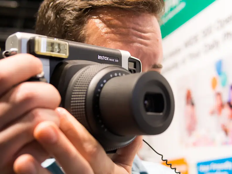 The Instax Wide 300 handles well thanks to its large grip, but the big body and small corner viewfinder are a slightly challenging pair.