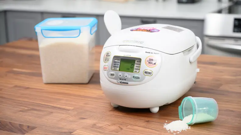 Zojirushi Neuro Fuzzy Logic rice cooker sitting on a table.
