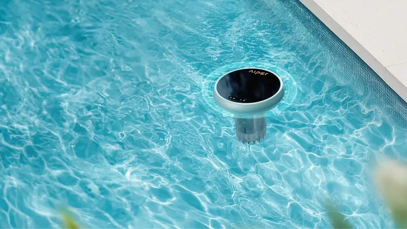 A round circular device floats in a pool