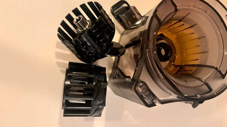 The Omega Effortless Batch Juicer deconstructed to get a closer look at each part.
