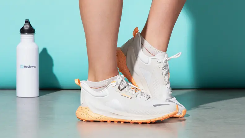 A woman wearing the lululemon Blissfeel Trail sneakers.