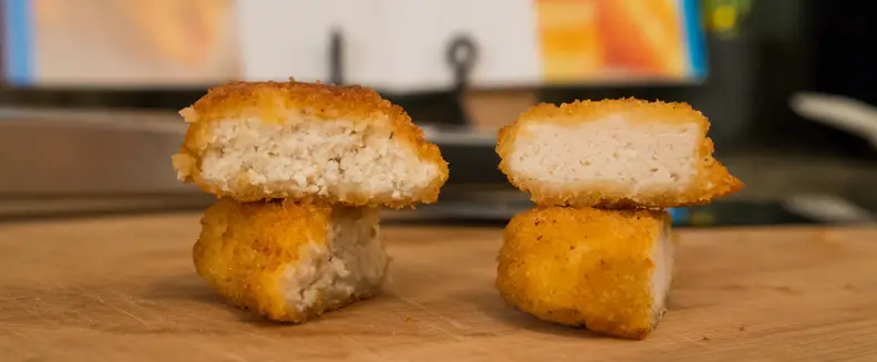Conventional oven on the left, Airfryer on the right. You can see the nugget on the right is a little more dense, while the baked nugget on the left has more gaps where moisture and flavor live.