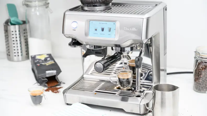 Breville Touch espresso machine sitting on counter.