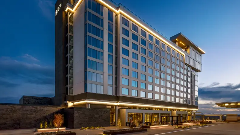 A hotel lit up in dusk