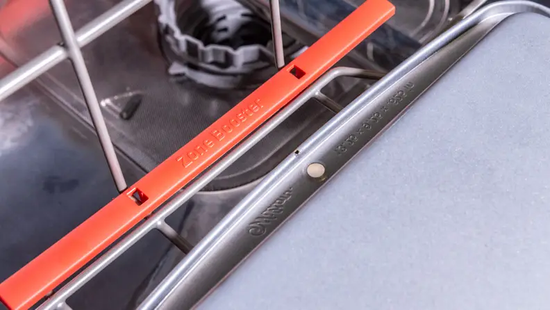 Zone Boost of the Samsung DW80M9960US  is a feature that directs nozzles towards the left-hand side of the lower rack. It cleaned even baked-on stains.