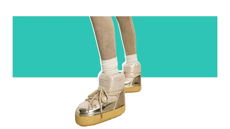 A model wearing gold puffer boots.