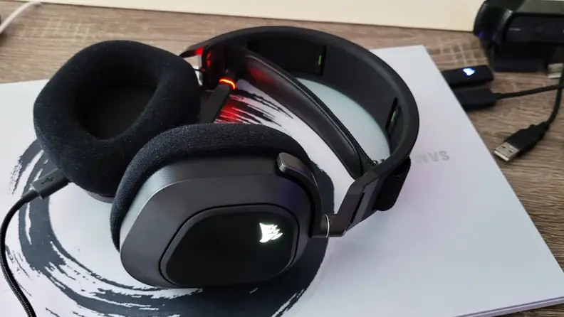 The Corsair HS80 sitting on a laptop