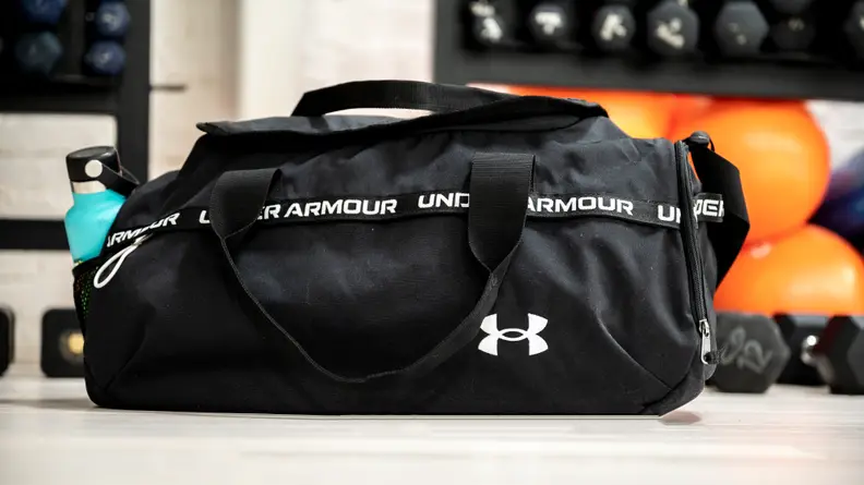A photo of the Under Armour Signature duffel bag with a water bottle in the pocket.
