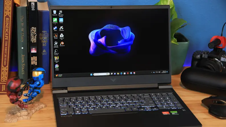 The HP Victus 16 opened up with a home screen on display.