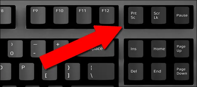 To capture a screenshot of your whole screen and save it to the clipboard so you can paste it later, press the Print Screen key on your keyboard