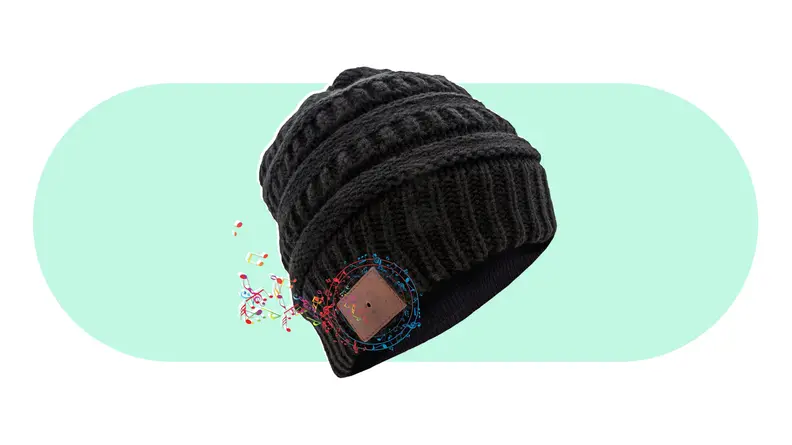 A beanie hat with an illustration of musical notes coming out of the side.