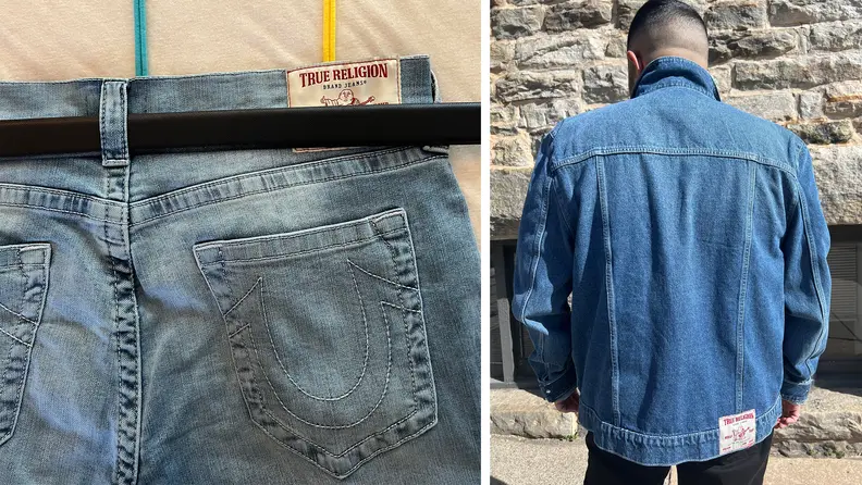 A man wearing a blue denim jacket seen from behind, and a belt woven through the belt loops of a pair of jeans, there is a lot of space left above the belt.