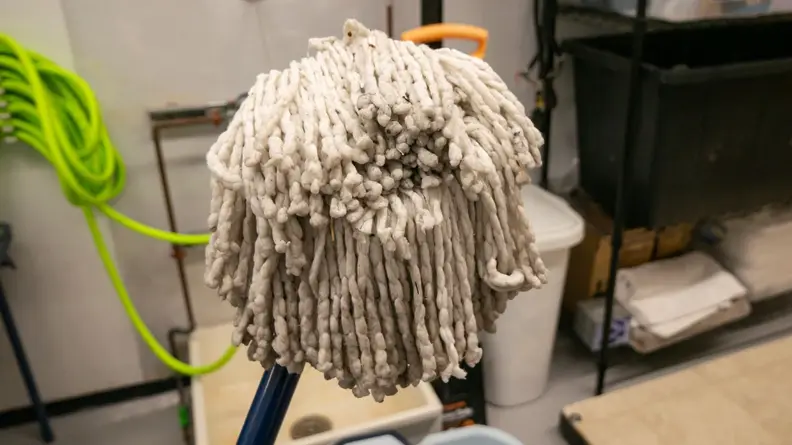 The Casabella spin mop’s head sits in the center of the frame.