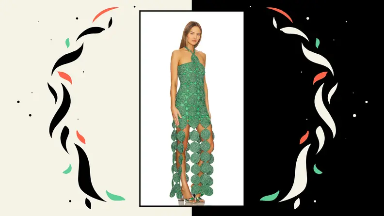 A model wearing a woven gown that features long, swinging circular fringe.