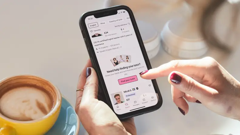 Browsing tutors in the Preply app on a smartphone, shown as part of our Preply review.
