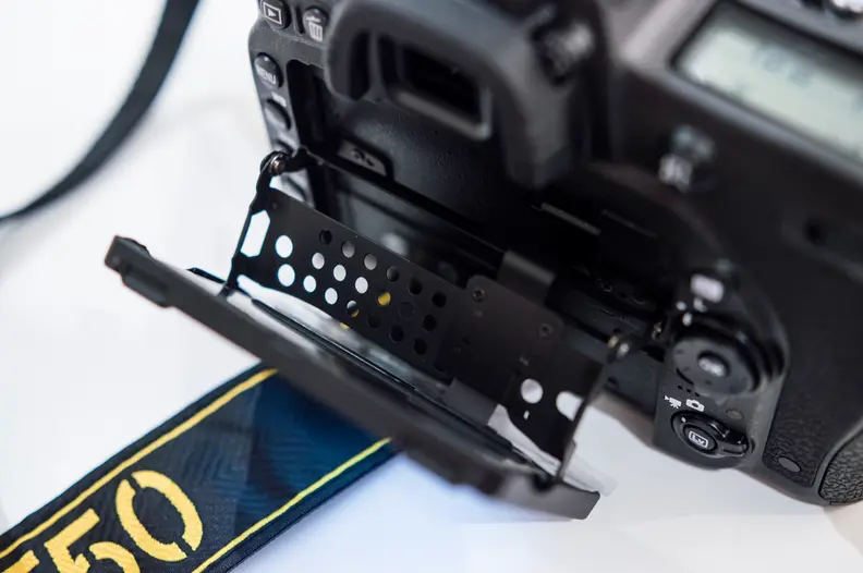 The screen tilts on a metal mount that is very sturdy.