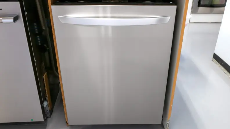A close-up of the front of the LG LDTH7972S dishwasher, installed in our testing labs.