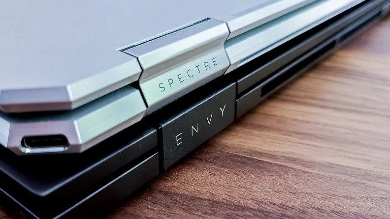 The HP Envy logo next to the HP Spectre logo