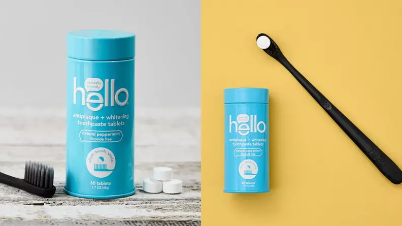 On the left: A blue tin with toothpaste tablets and a toothbrush sitting beside it. On the right: A black tooth brush lay next to a blue tin of toothpaste tablets.