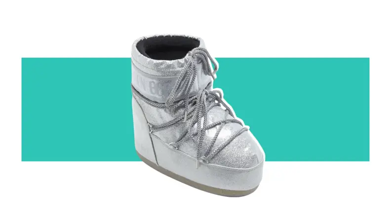 A short puffy silver Moon Boot.