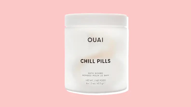 Ouai Chill Pills against a pink background.