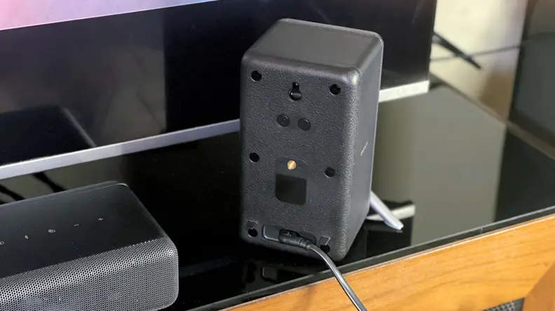 Surround sound speaker next to Sony HT A3000.