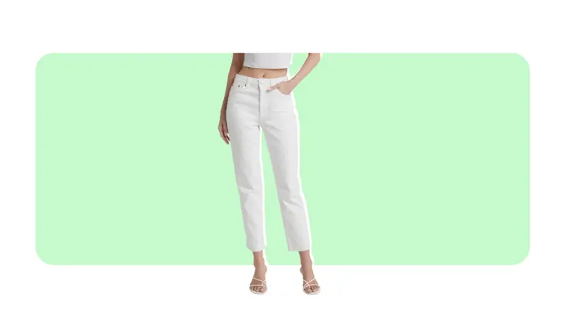 A model wears cropped white skinny jeans.