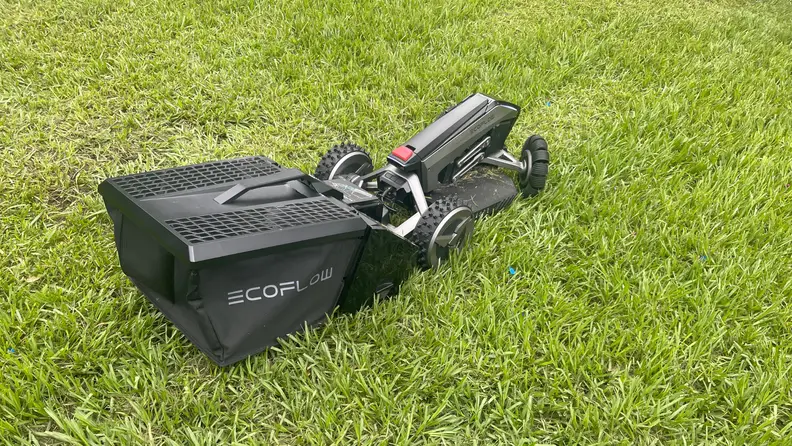 EcoFlow Blade Robotic Lawn Mower on green lawn outdoors.