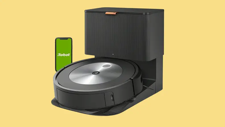 A Roomba on a yellow backgroung.