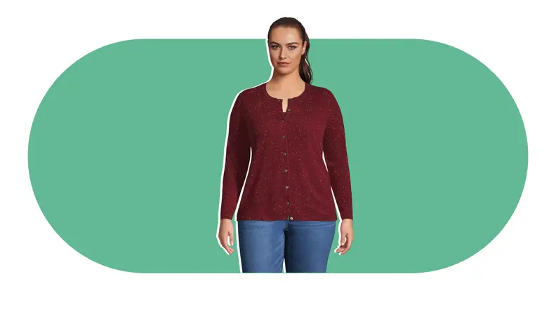 A model wearing a burgundy cashmere cardigan sweater.