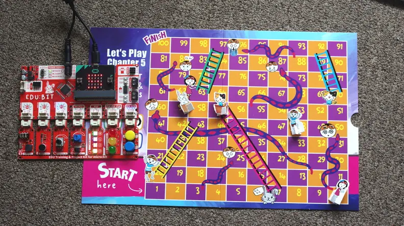 The EDU:BIT kit neatly combines computer programming with fun games like Snakes and Ladders.