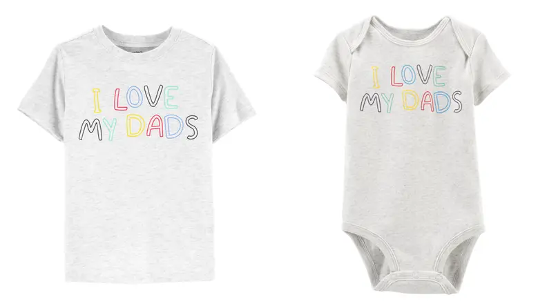 A grey tshirt with rainbow lettering that say I love my dads, next to a baby's onesie in the identical style