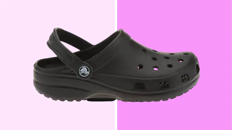 An image of a single black Croc clog shoe seen from the side.