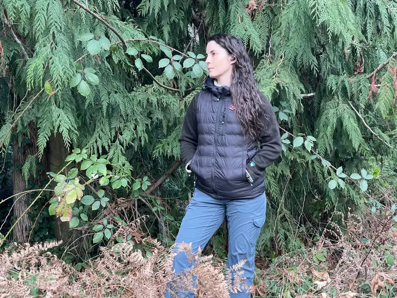 Woman in the forest wearing a COREEDGE vest