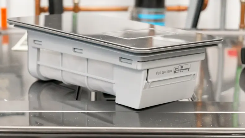 Close-up of the LG washer dryer combo's removable filter.
