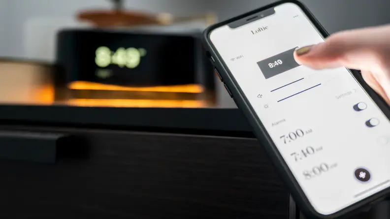 someone uses the loftie phone app to control the alarm clock