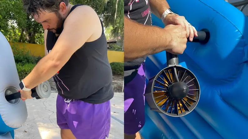Person using pump to inflate the PoolCandy Splash Runner motorized pool float outdoors.