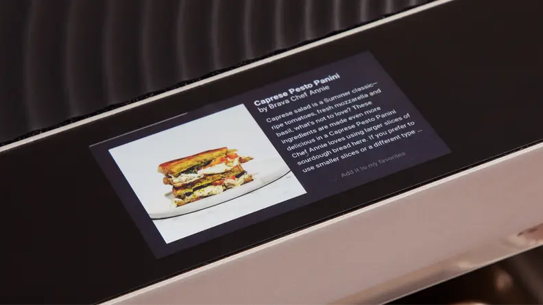 A closer view of the Brava Glass oven's touchscreen featuring a recipe for a caprese pesto panini.