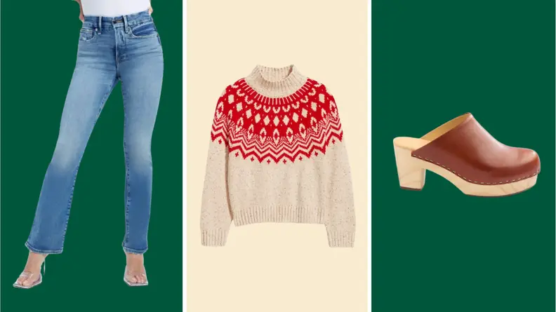 A model wearing bootcut blue jeans, a white and red Fair Isle sweater, and a brown leather clog with wooden heel.