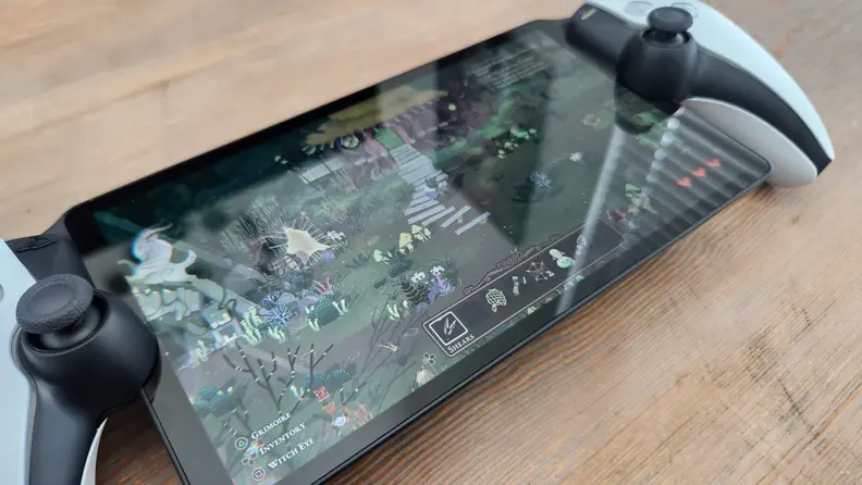 A close up of sunlight glare on the  small LCD screen of the playstation portal.