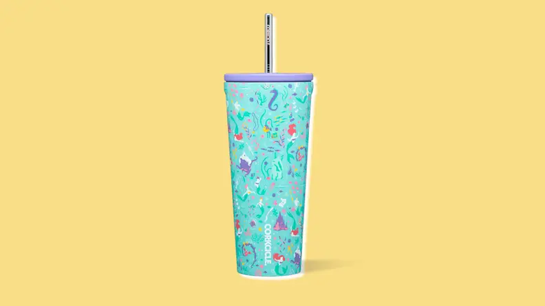 A turquoise drink tumbler with a repeating pattern of stylized characters from "The Little Mermaid"