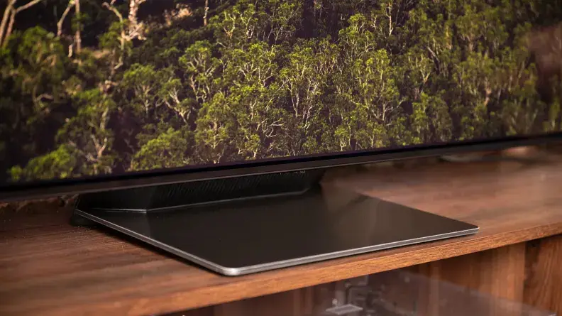 A close-up of the Samsung S95B's pedestal-style stand