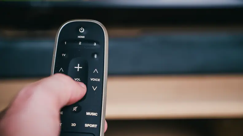 Polk Magnifi 2 remote in hand