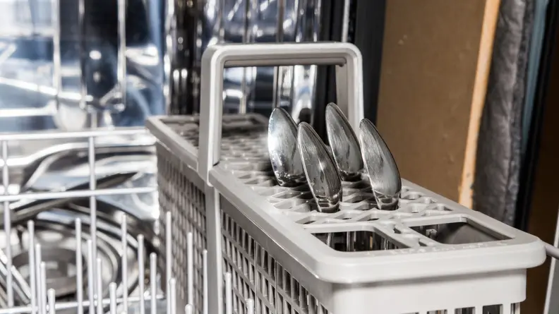 The silverware basket has slots for individual pieces