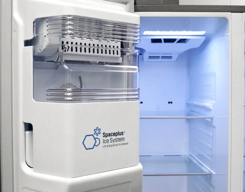 Ice maker mounted on freezer door