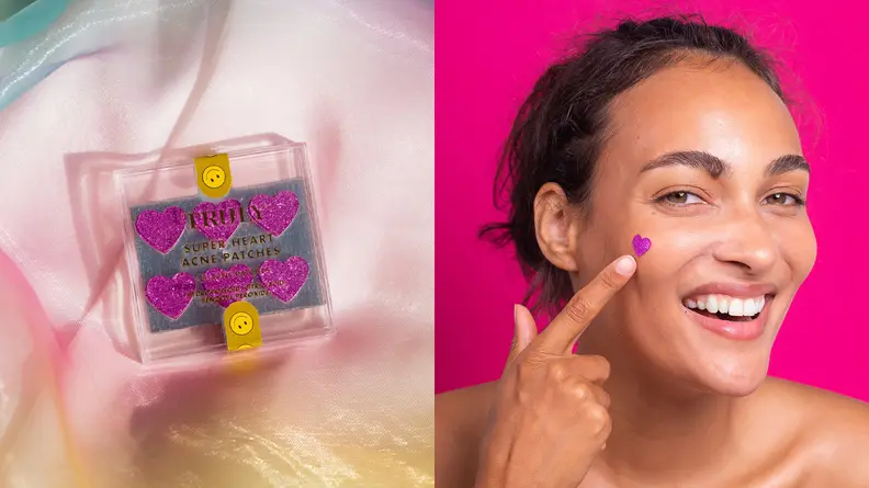 On the left: The package of Super Heart Acne Patches sits on a rainbow sheet. The patches are sparkly pink and heart shaped. On the right: A woman smiles and applies the heart-shaped pimple patch to her cheek and smiles.